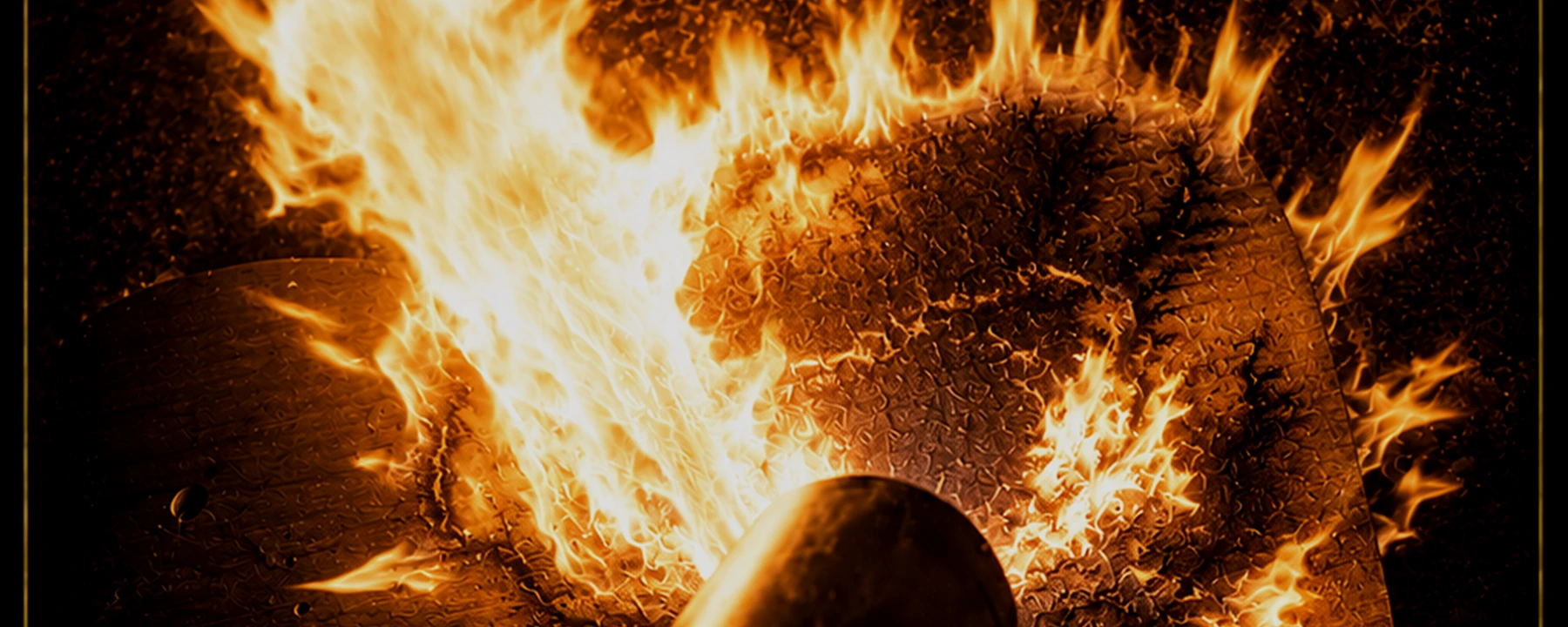 Torch burning a guitar body during the fractal burning process